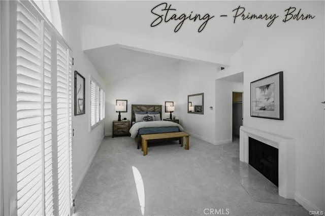 a bedroom with furniture and a fireplace