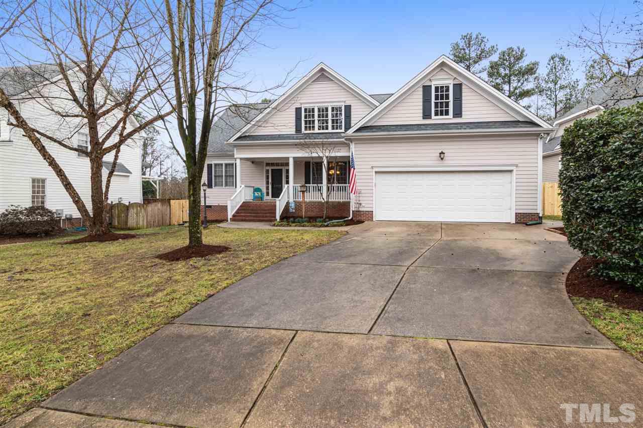 2408 Carruthers Court Raleigh, NC 27615 - Photo 1 of 30 a front view of a house with a yard and garage