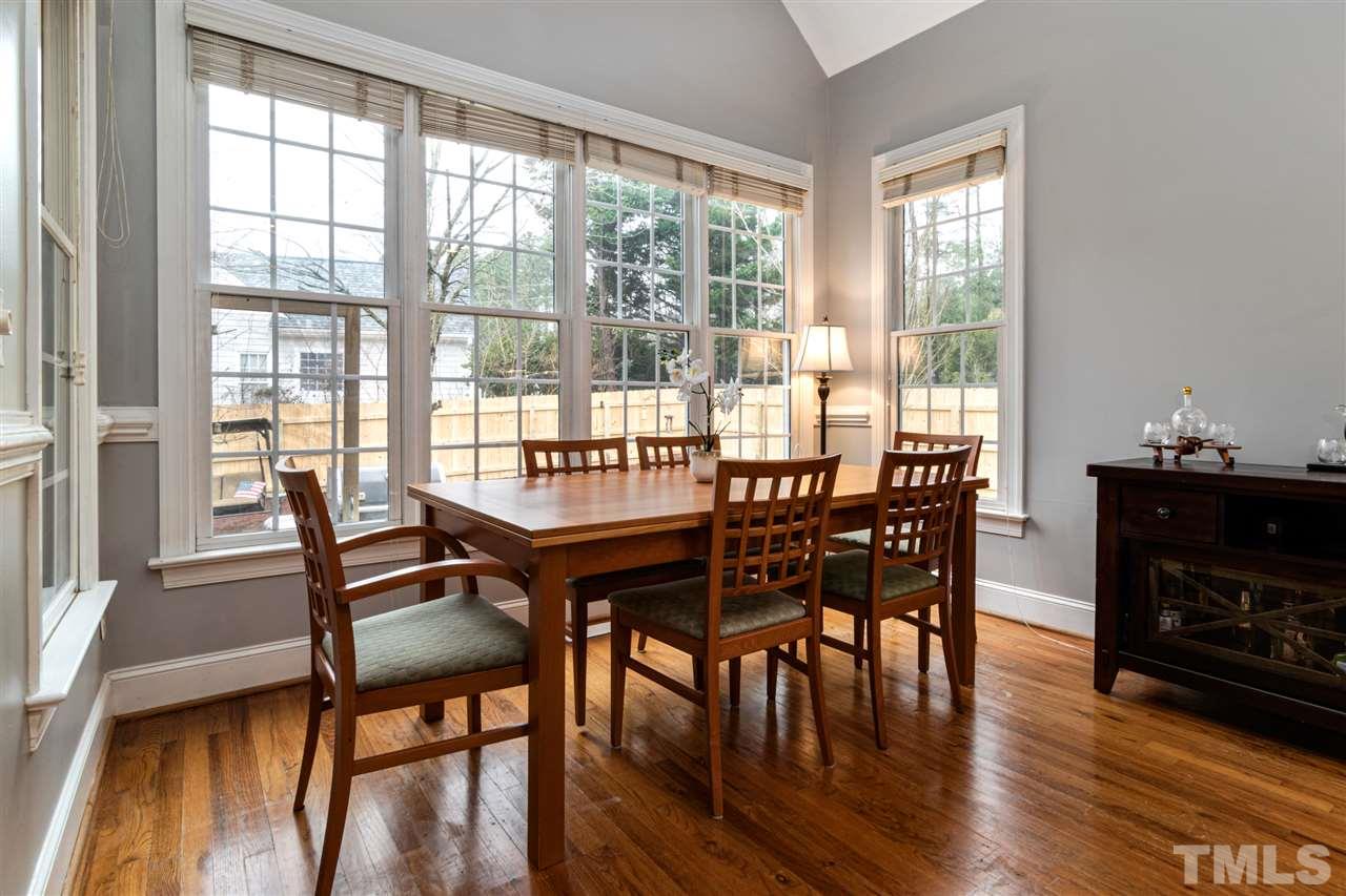 2408 Carruthers Court Raleigh, NC 27615 - Photo 11 of 30 a view of a dining room with furniture window and wooden floor
