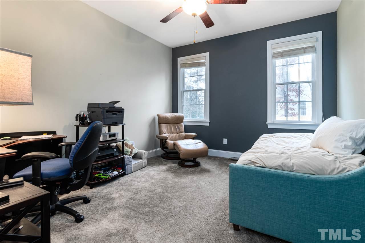 2408 Carruthers Court Raleigh, NC 27615 - Photo 20 of 30 a bedroom with bed and a window