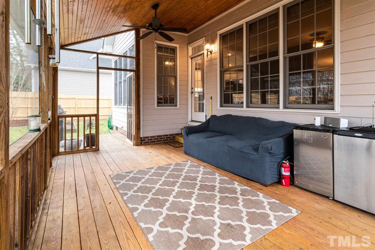 2408 Carruthers Court Raleigh, NC 27615 - Photo 24 of 30 a view of a balcony with wooden floor and iron stairs