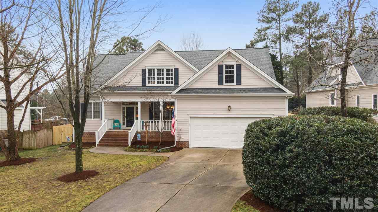 2408 Carruthers Court Raleigh, NC 27615 - Photo 29 of 30 a front view of a house with a yard and garage