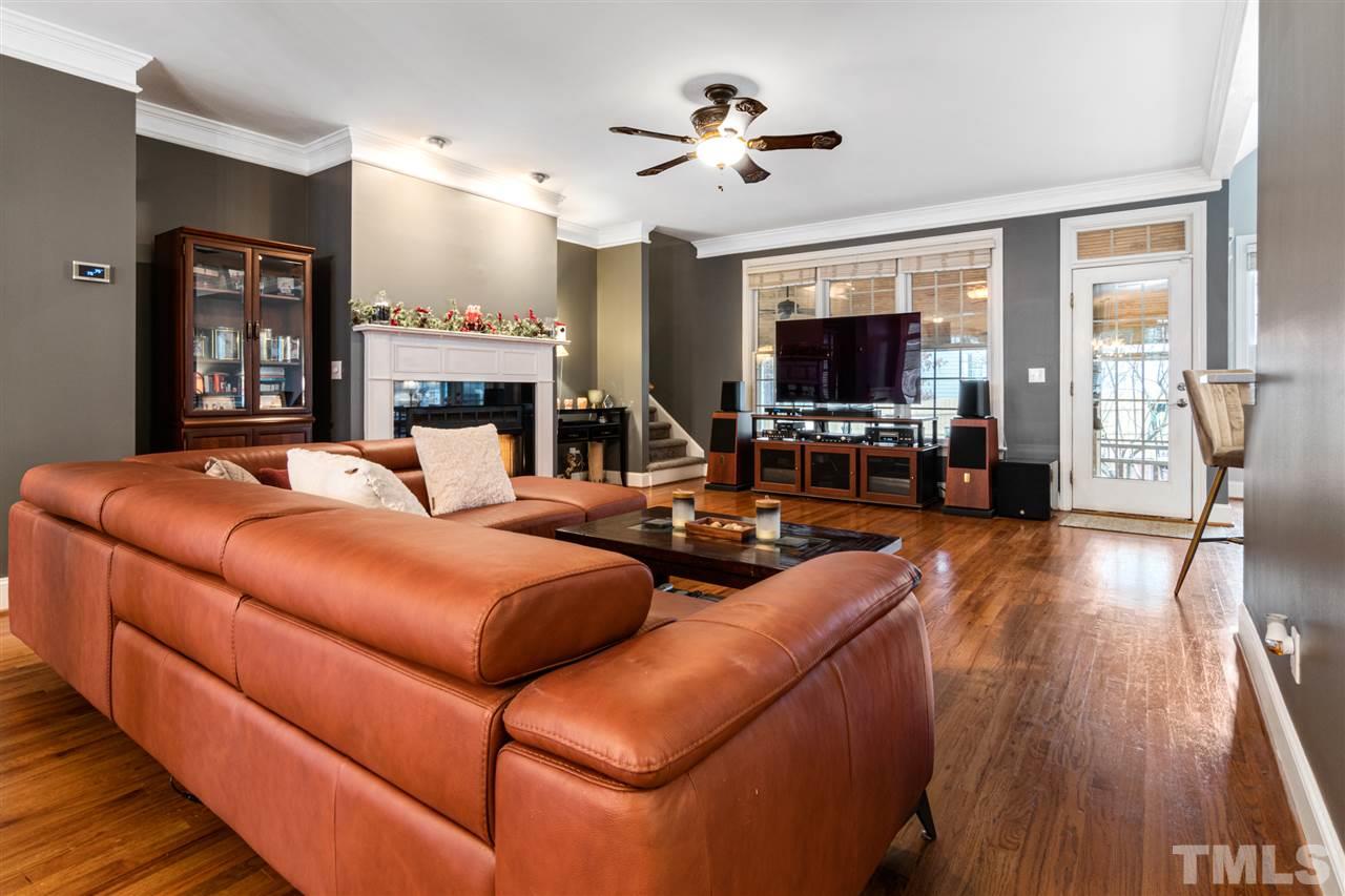 2408 Carruthers Court Raleigh, NC 27615 - Photo 6 of 30 a living room with furniture and a flat screen tv