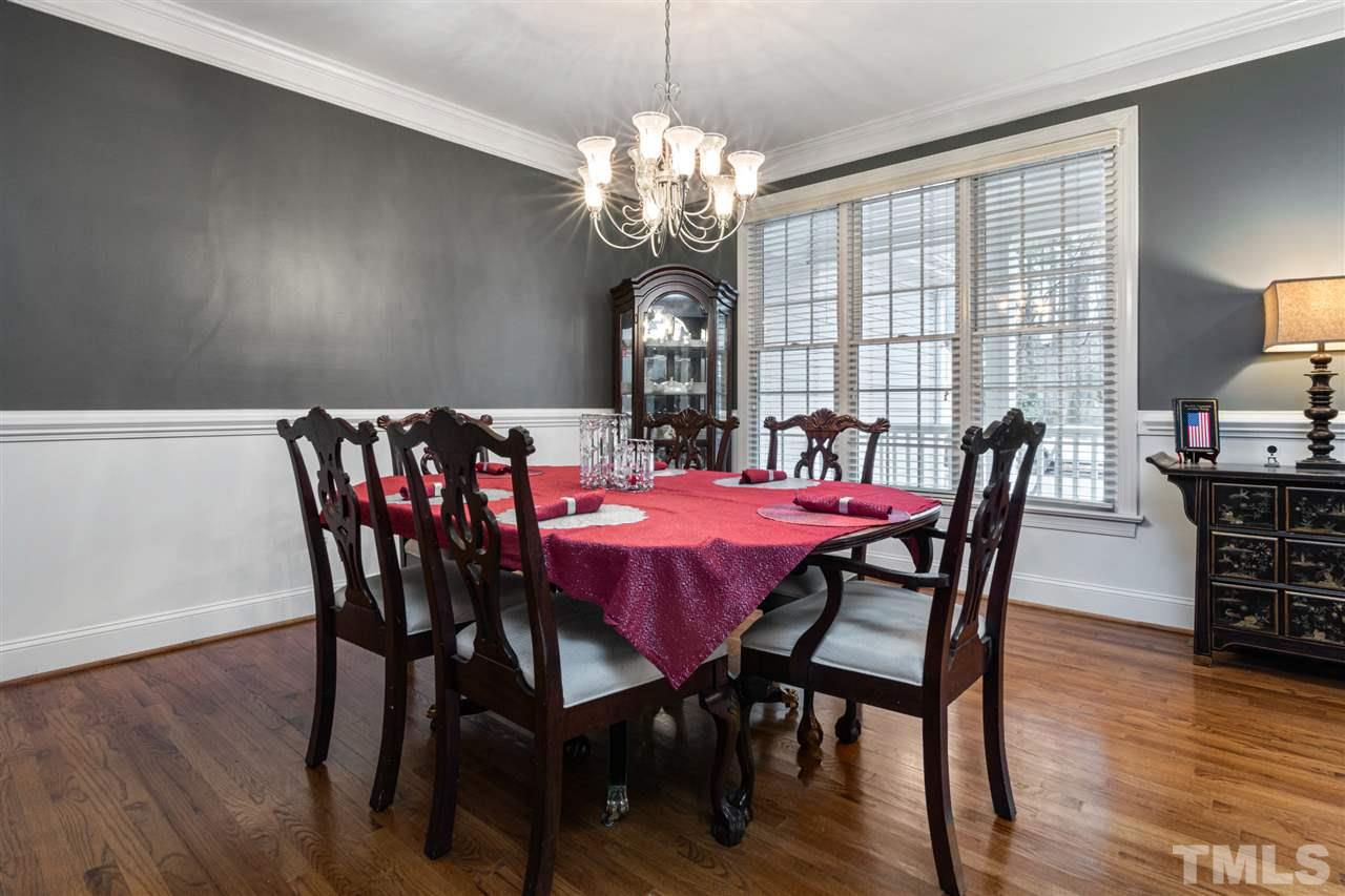 2408 Carruthers Court Raleigh, NC 27615 - Photo 7 of 30 a view of a dining room with furniture window and wooden floor