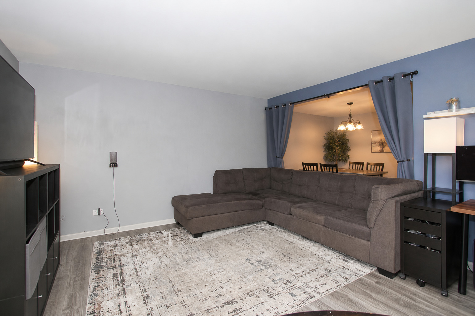 2300 Old Tavern Road, Unit 203 Lisle, IL 60532 - Photo 5 of 26 a living room with furniture and a large window