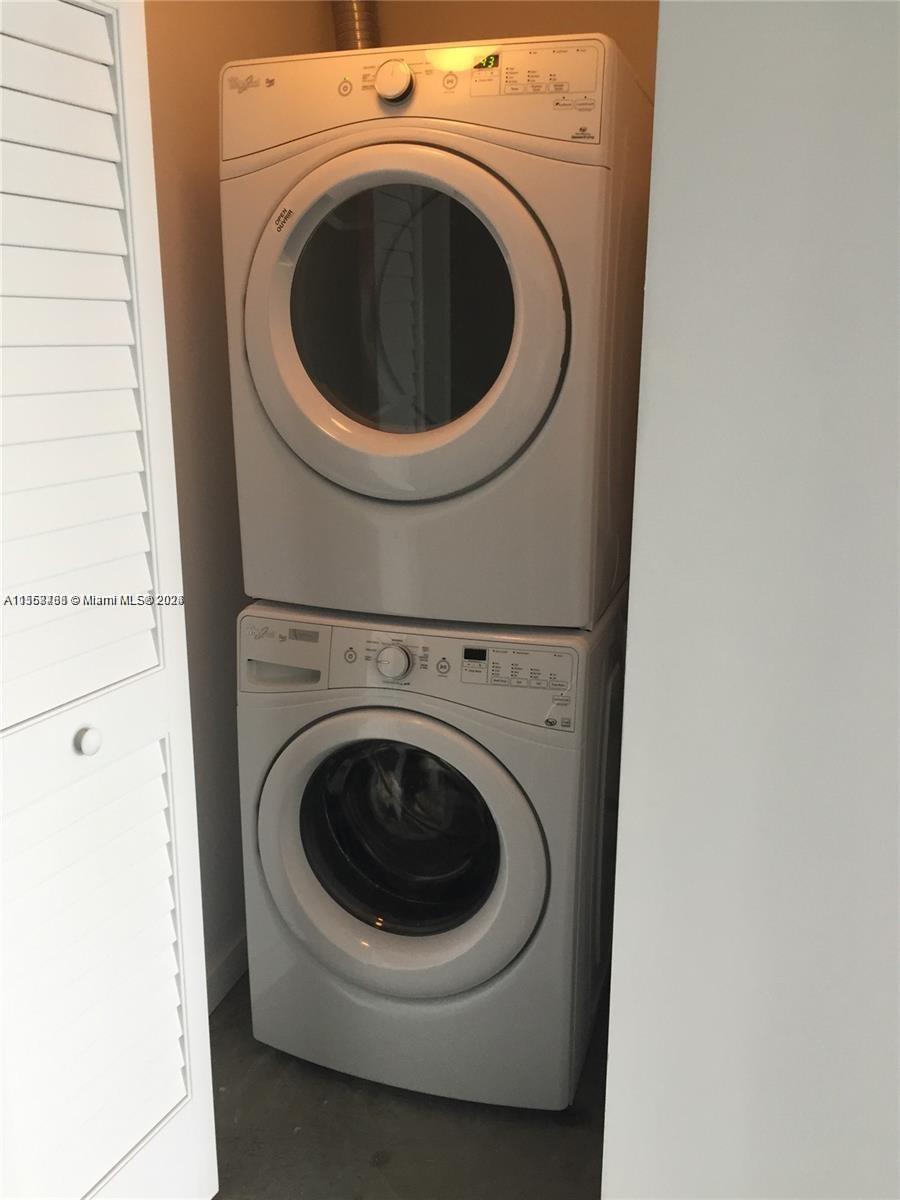 151 Southeast 1st Street, Unit 1505 Miami, FL 33131 - Photo 15 of 23 a utility room with dryer and washer
