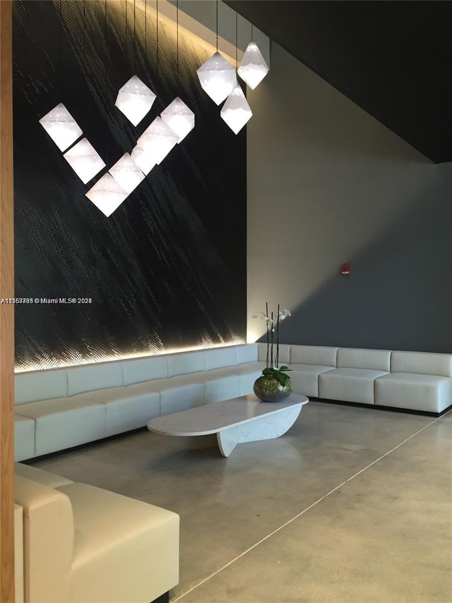 151 Southeast 1st Street, Unit 1505 Miami, FL 33131 - Photo 16 of 23 a bathroom with a bathtub and a shower