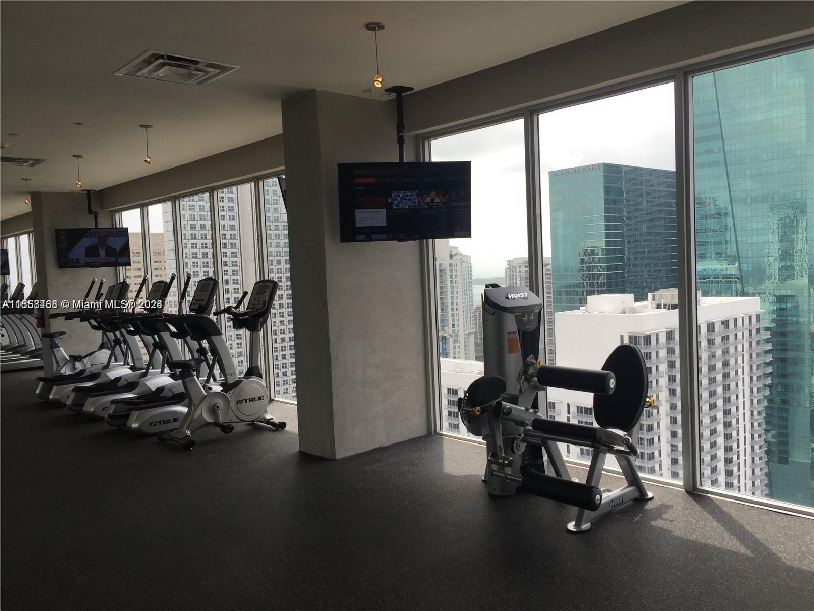 151 Southeast 1st Street, Unit 1505 Miami, FL 33131 - Photo 21 of 23 a view of a dining room with furniture window and outside view