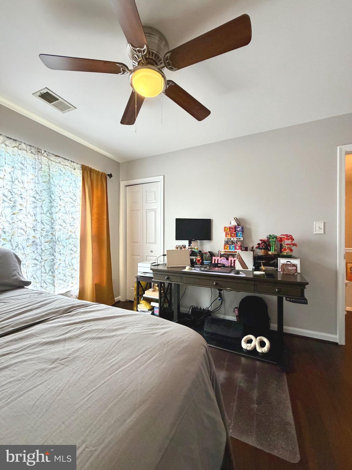 7108 Wheeling Way Gainesville, VA 20155 - Photo 35 of 45 a bedroom with a bed and a desk