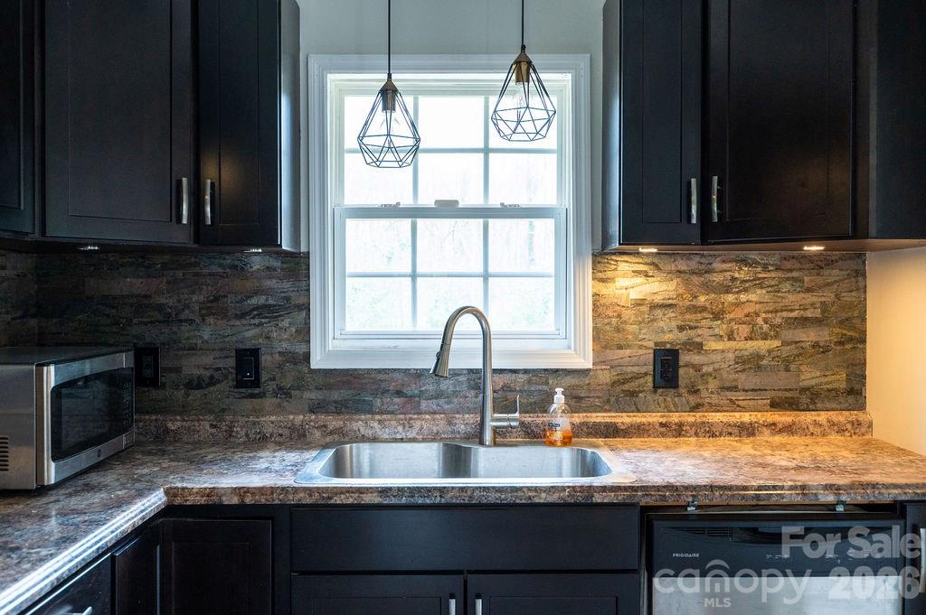 226 B Brookwood Road Belmont, NC 28012 - Photo 11 of 29 a kitchen with granite countertop a sink and a stove