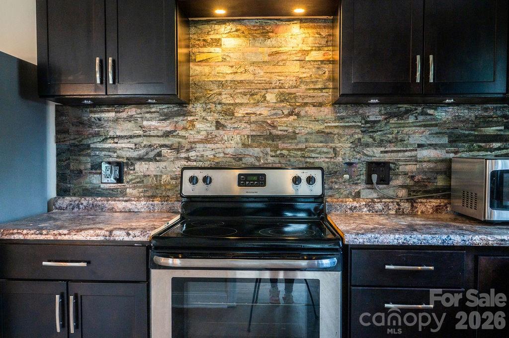 226 B Brookwood Road Belmont, NC 28012 - Photo 12 of 29 a kitchen with a stove and a microwave