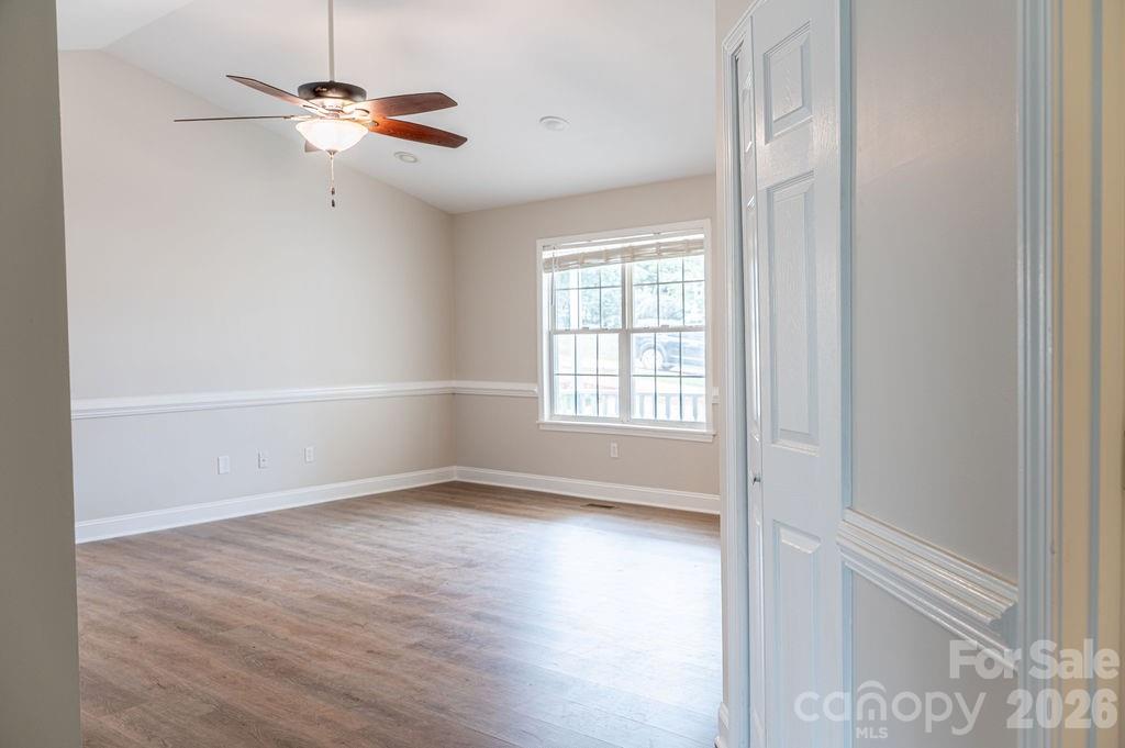 226 B Brookwood Road Belmont, NC 28012 - Photo 13 of 29 wooden floor in an empty room with a window