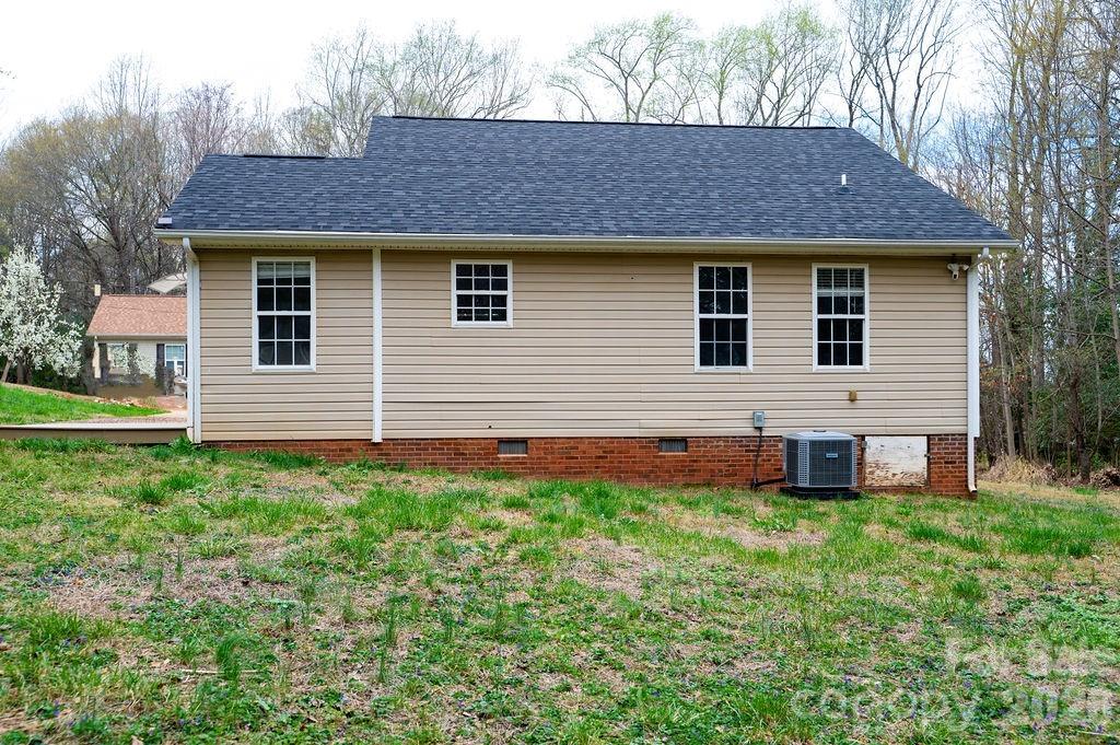 226 B Brookwood Road Belmont, NC 28012 - Photo 27 of 29 a front view of a house with a garden