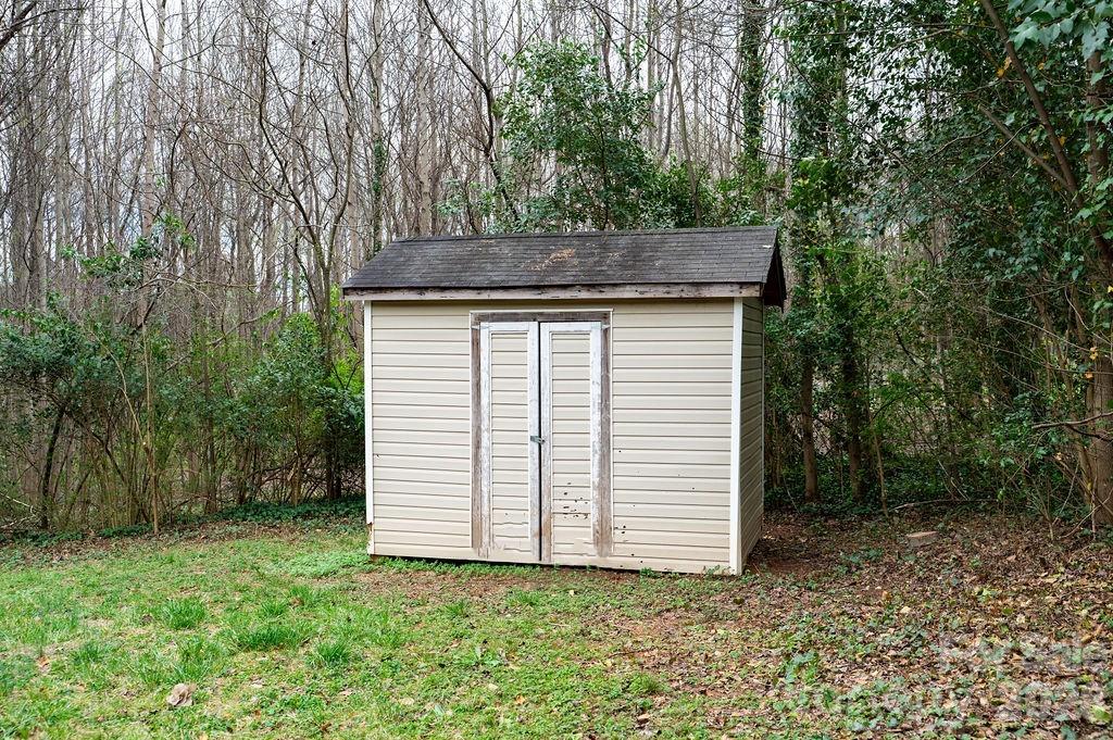 226 B Brookwood Road Belmont, NC 28012 - Photo 29 of 29 a view of a house with a yard