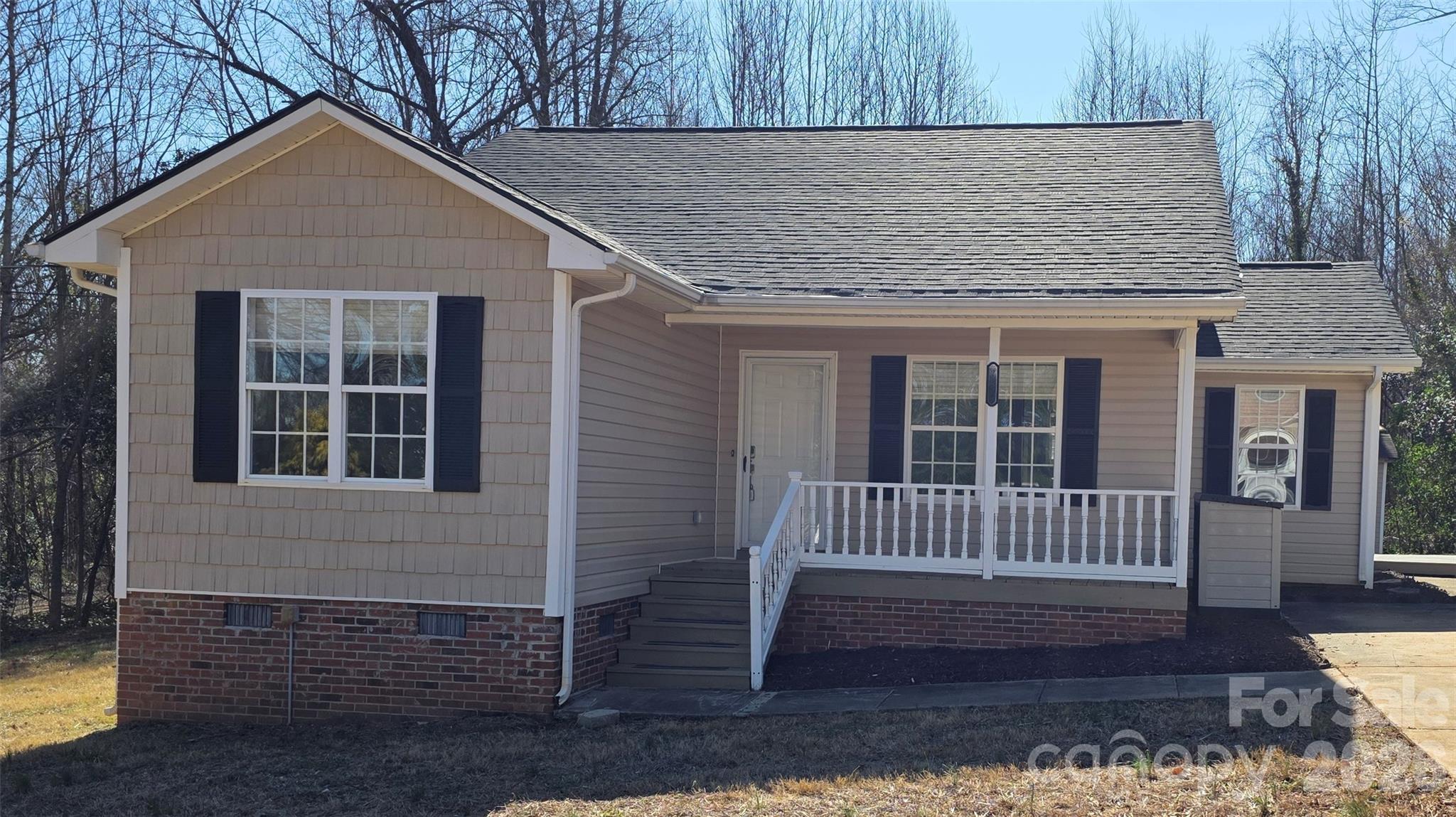226 B Brookwood Road Belmont, NC 28012 - Photo 5 of 29 a front view of a house with a yard