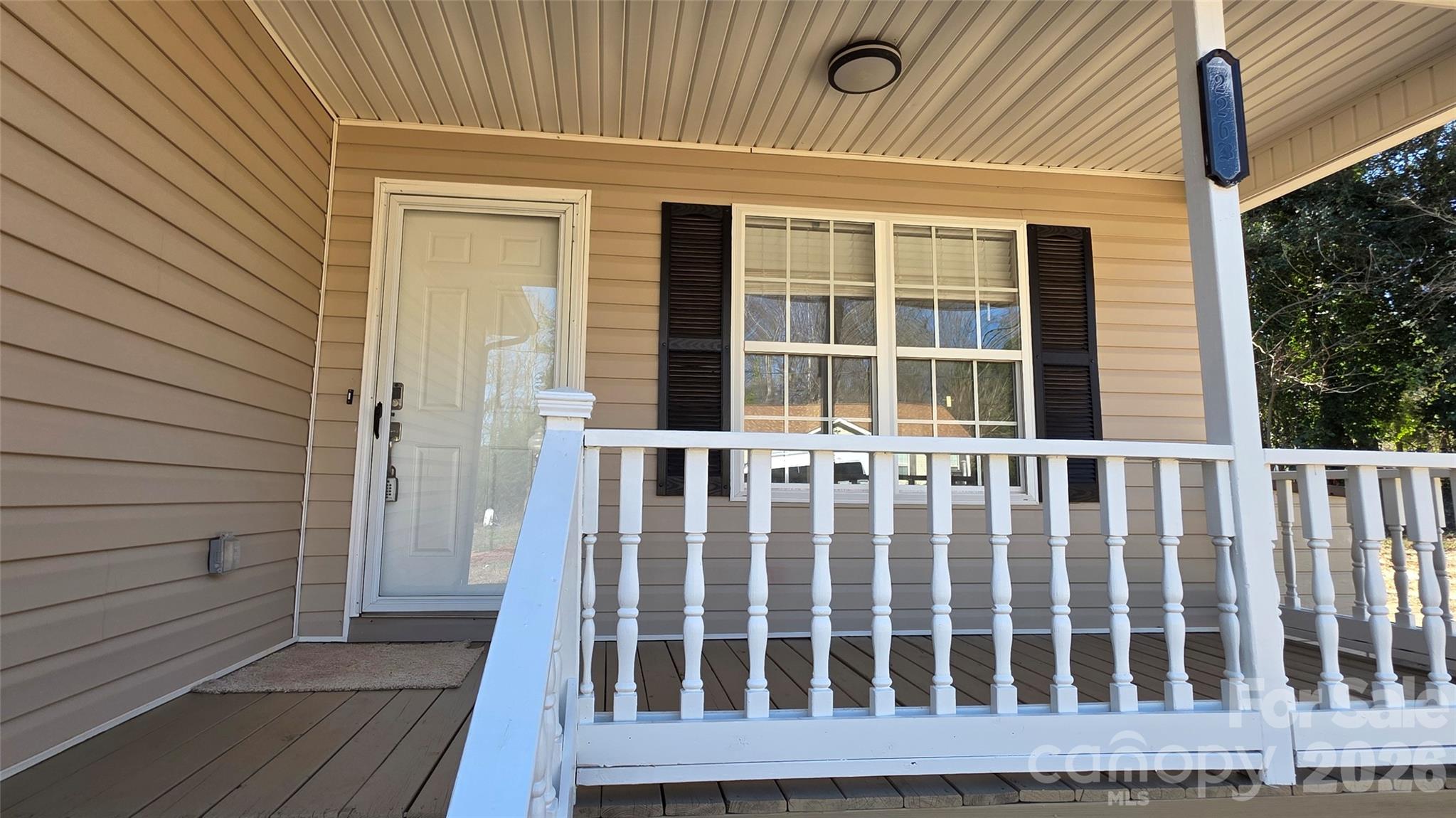 226 B Brookwood Road Belmont, NC 28012 - Photo 6 of 29 a view of a wooden bench in a porch