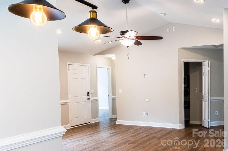 226 B Brookwood Road Belmont, NC 28012 - Photo 8 of 29 wooden floor in an empty room with a window