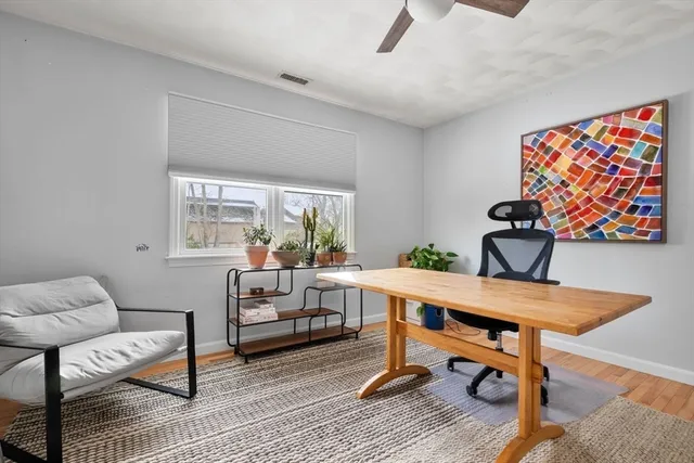 a bedroom with a bed and a television