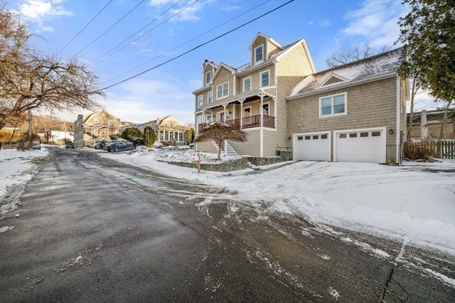 a view of a house with a snow on the road