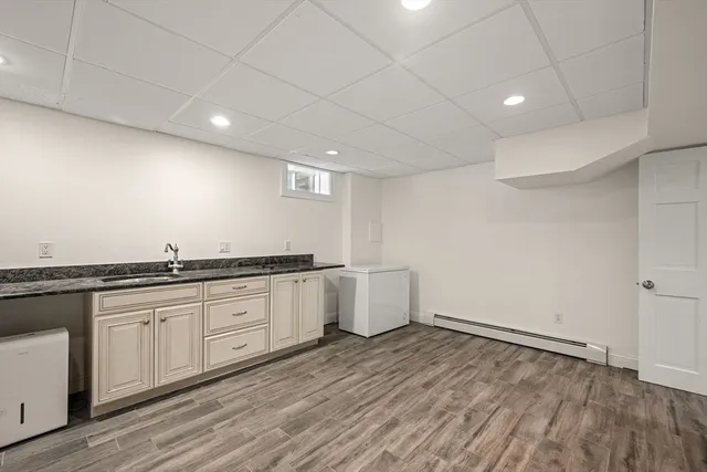 a view of a refrigerator in kitchen and wooden floor