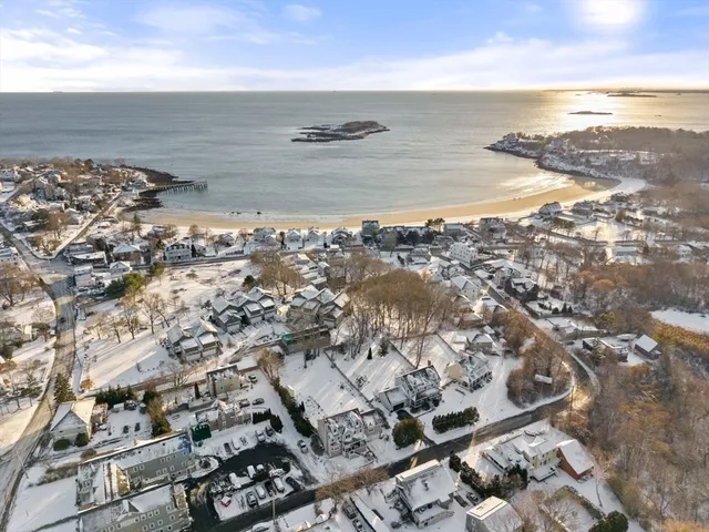 an aerial view of residential building with ocean view