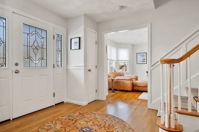 a view of an empty room and wooden floor