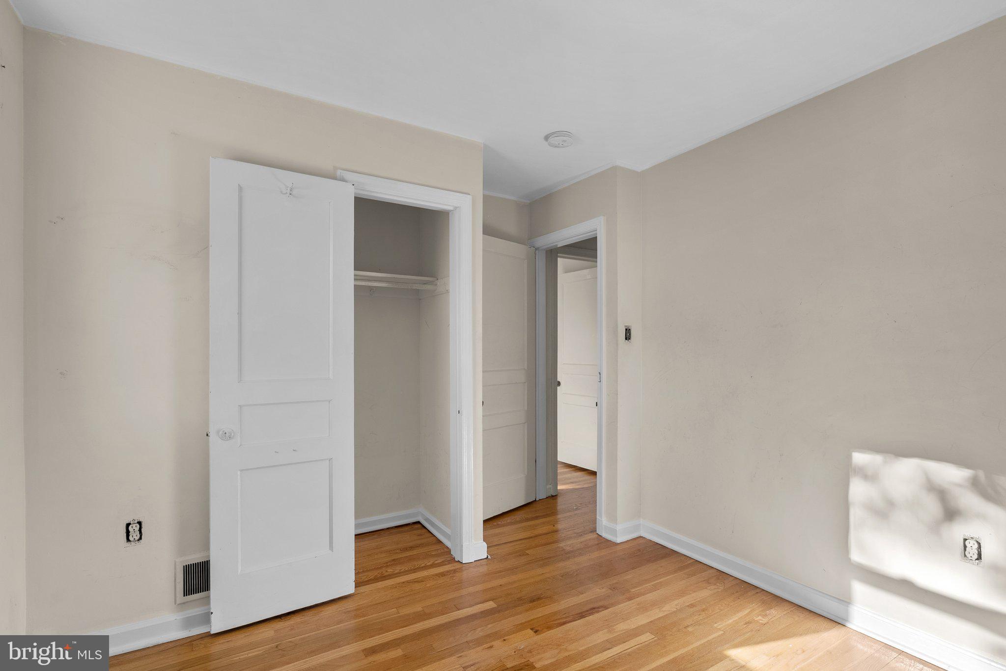 502 Lanark Way Silver Spring, MD 20901 - Photo 17 of 29 a view of an empty room with wooden floor