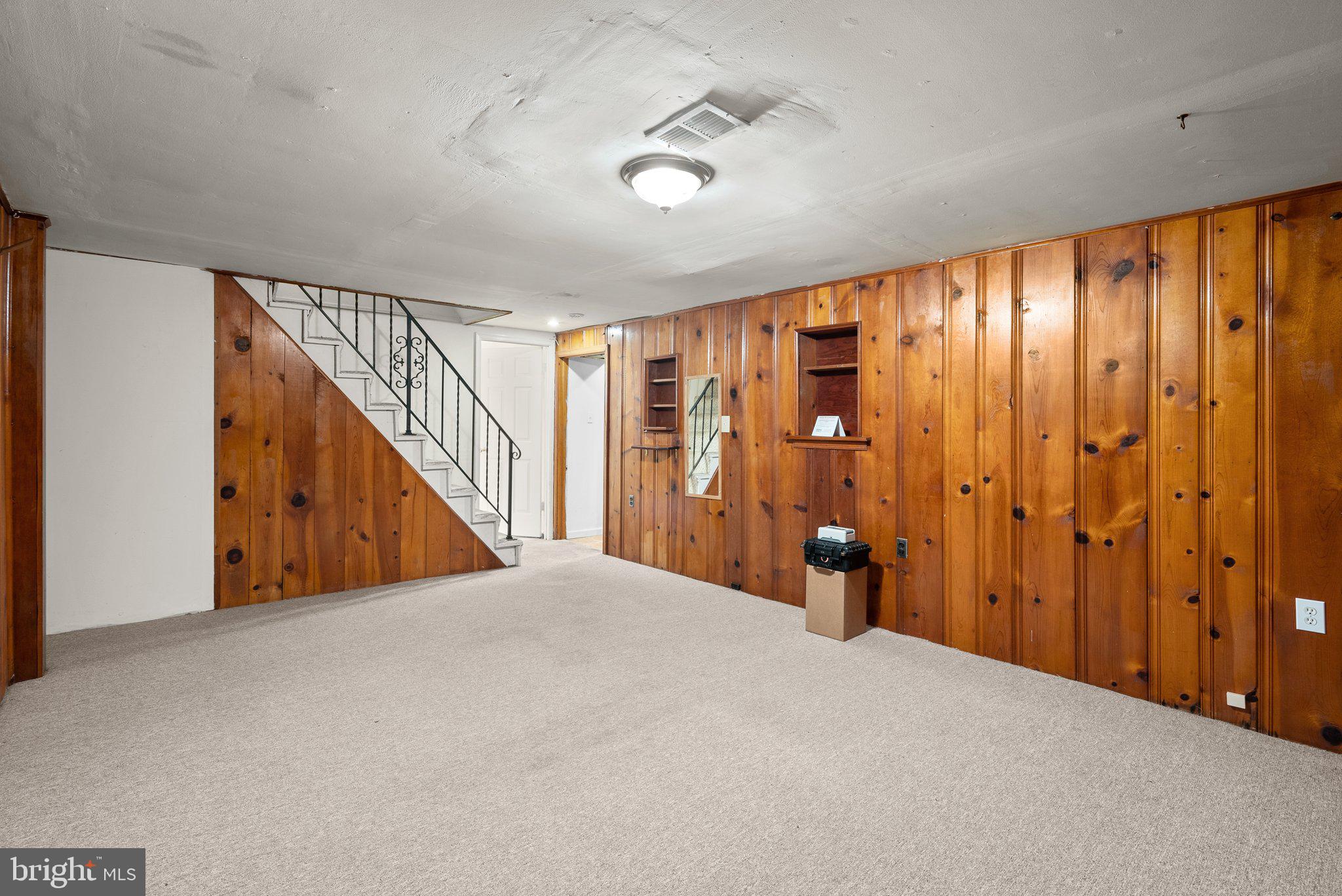 502 Lanark Way Silver Spring, MD 20901 - Photo 19 of 29 a view of an empty room with wooden floor and entryway
