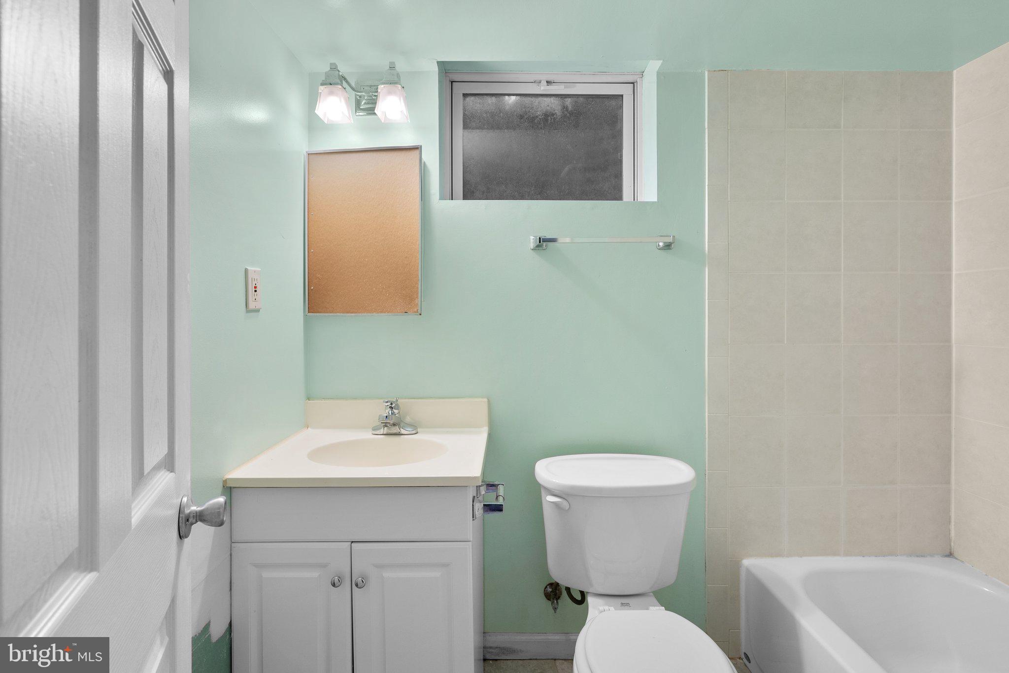 502 Lanark Way Silver Spring, MD 20901 - Photo 23 of 29 a bathroom with a toilet sink and mirror