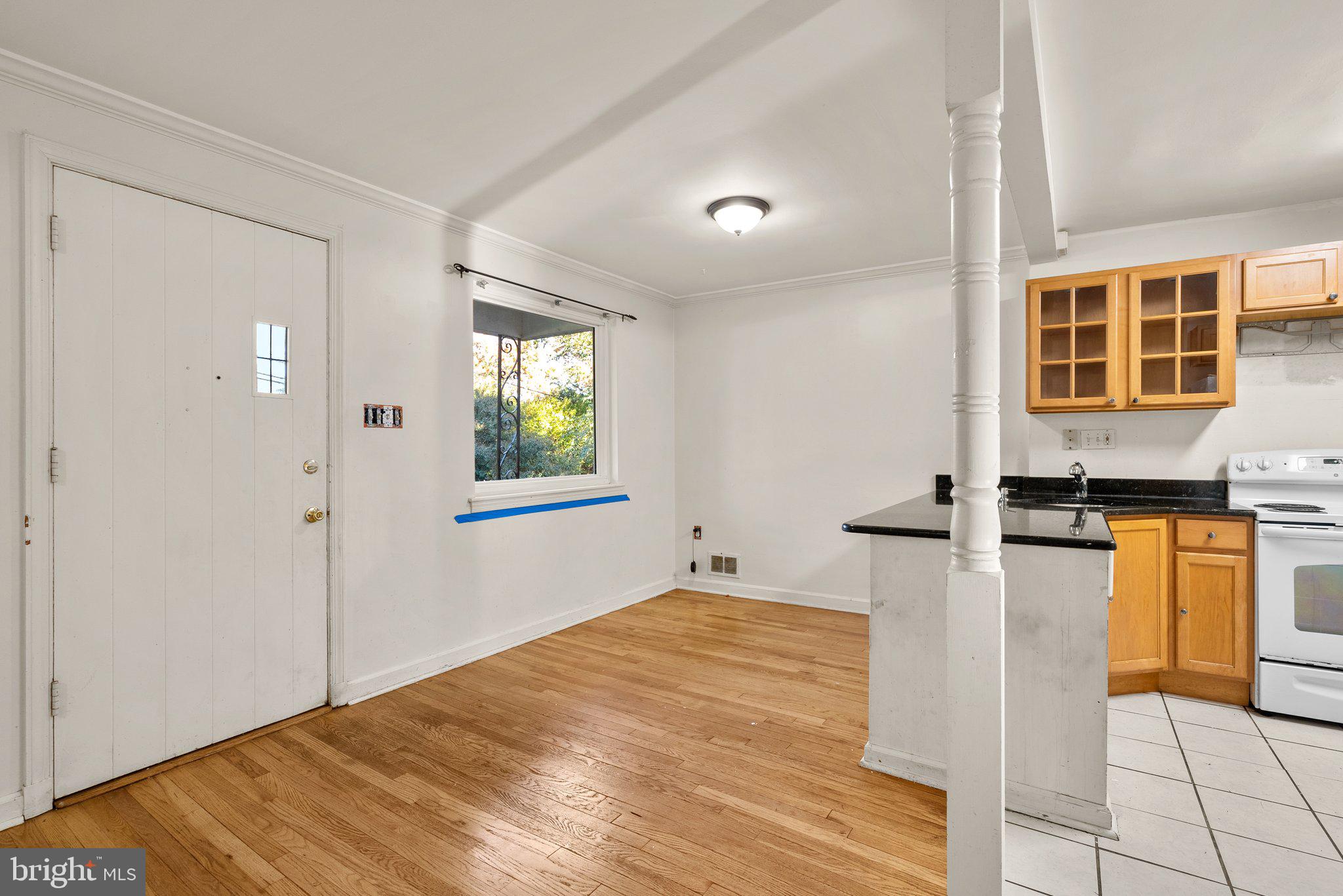 502 Lanark Way Silver Spring, MD 20901 - Photo 7 of 29 a view of a livingroom with wooden floor and a ceiling fan