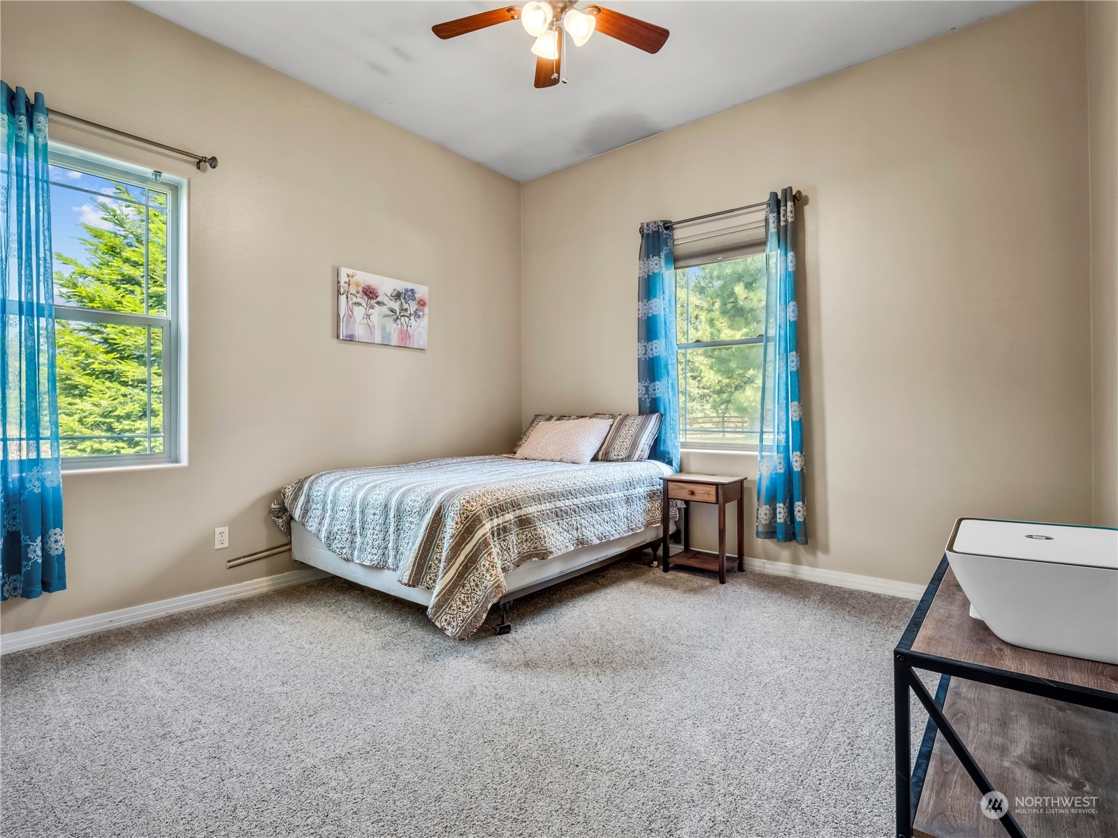 470 Old Cedars Road Cle Elum, WA 98922 - Photo 14 of 25 a bedroom with a bed and a chandelier