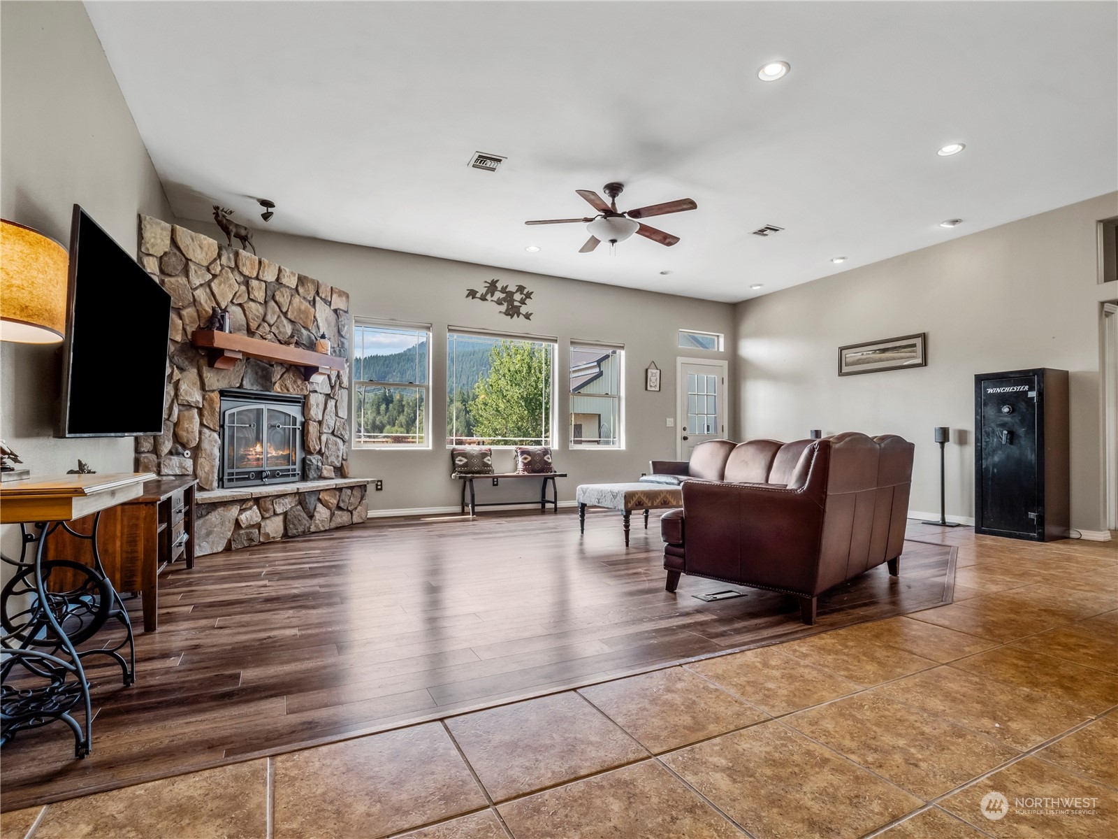 470 Old Cedars Road Cle Elum, WA 98922 - Photo 6 of 25 a living room with furniture and a flat screen tv
