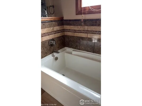 a bathroom with a sink and a microwave