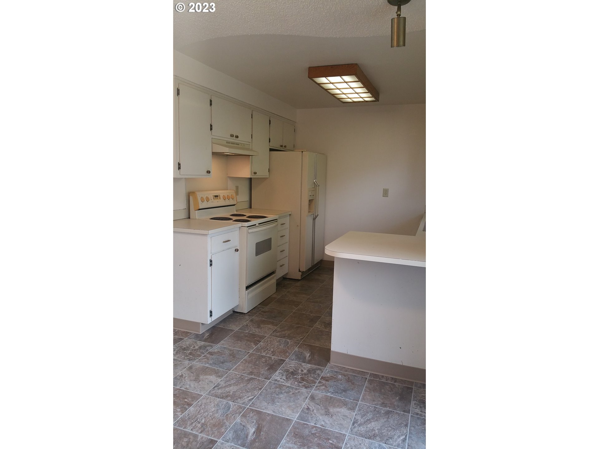 806 V Street Springfield, OR 97477 - Photo 14 of 14 a kitchen with a sink and cabinets