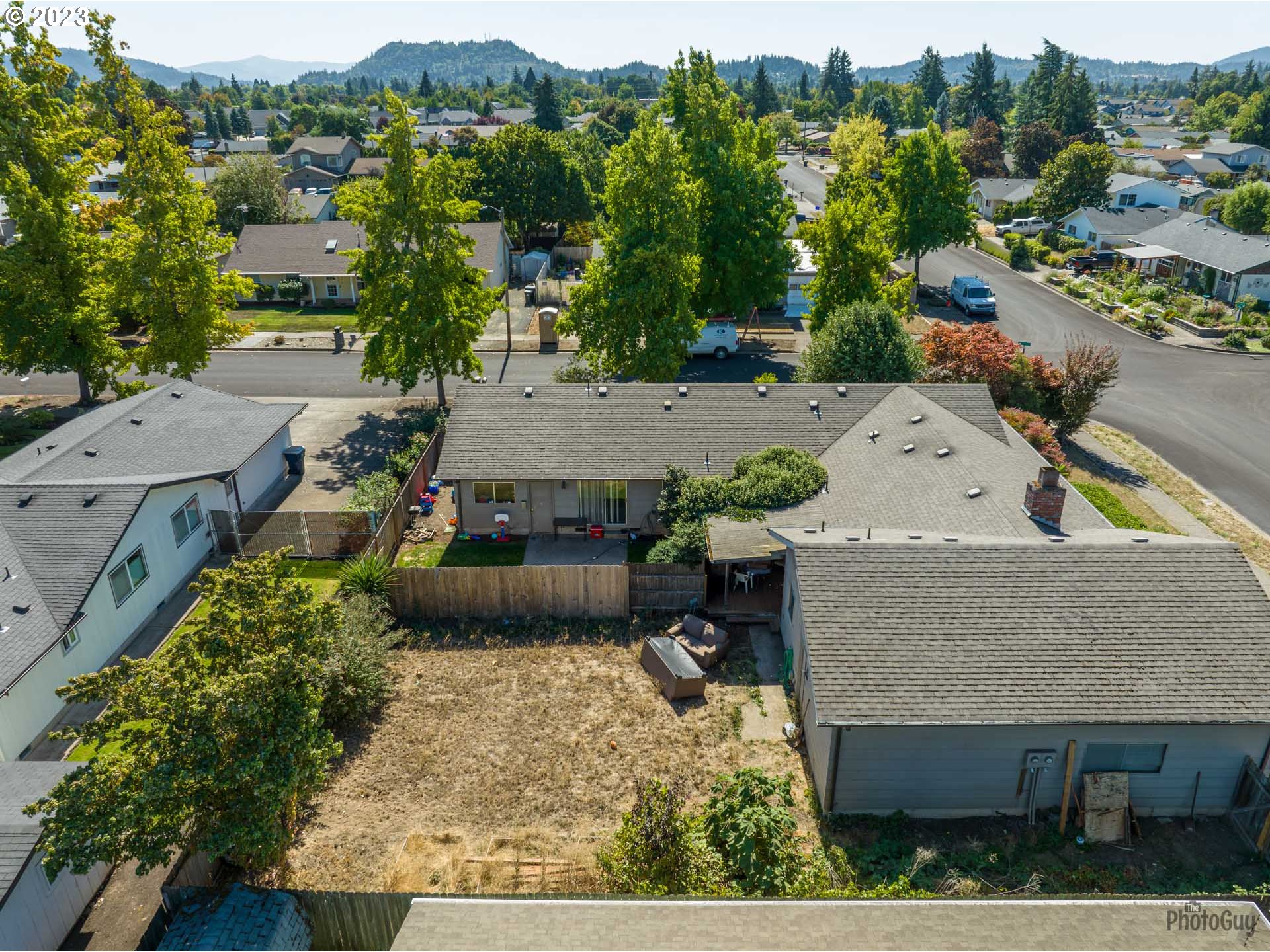 806 V Street Springfield, OR 97477 - Photo 8 of 14 an aerial view of a house with a yard