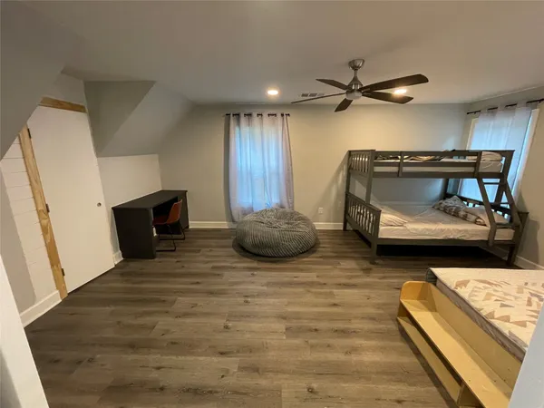 a bedroom with bed and window