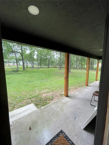a view of an empty room with a large window
