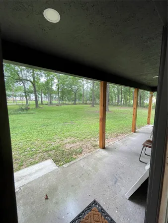 a view of an empty room with a large window