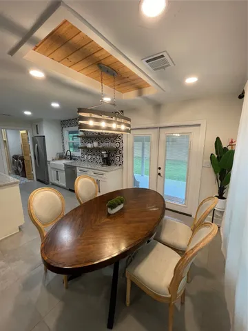 a room with furniture and a chandelier