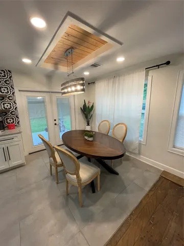 a dining room with furniture and window