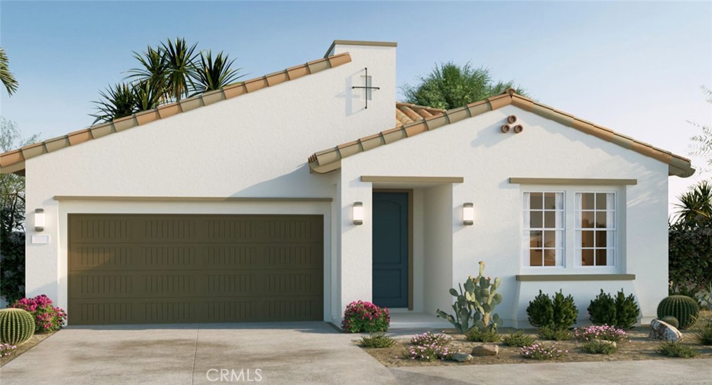 73620 Raphael Drive Palm Desert, CA 92211 - Photo 1 of 2 a view of a white house with potted plants