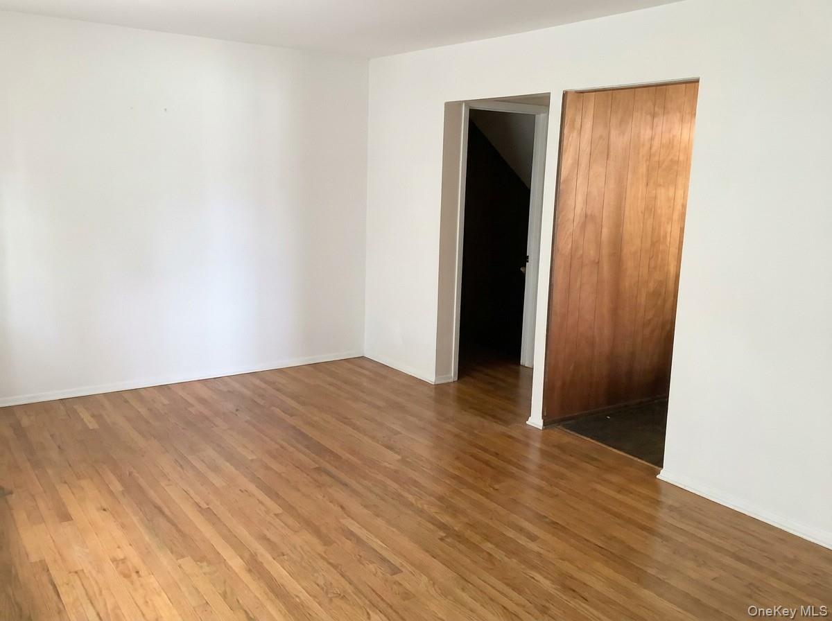 2 Sneden Court Spring Valley, NY 10977 - Photo 5 of 13 an empty room with wooden floor and closet