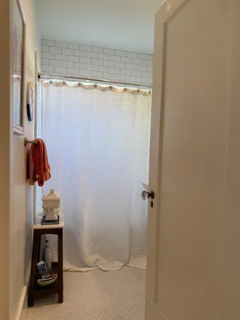 a bathroom with a tub and a sink