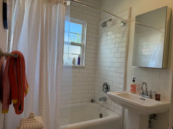 a white toilet sitting next to a bathroom sink