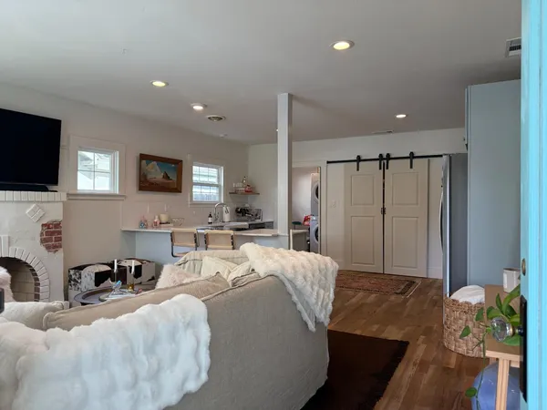 a bed room with a bed window and a television