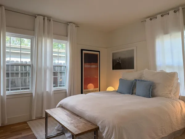 a bedroom with a bed and a dresser