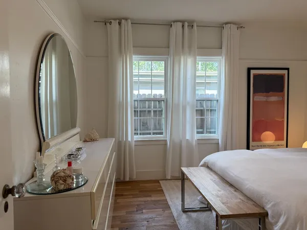 a living room with lots of furniture and a flat screen tv