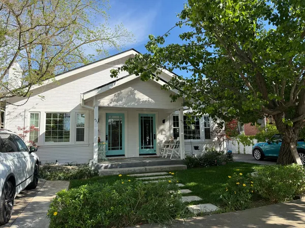a front view of a house with garden