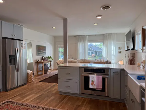 a kitchen with stainless steel appliances granite countertop a stove and a refrigerator