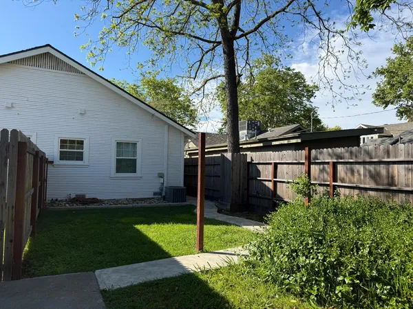a view of a backyard with a tub